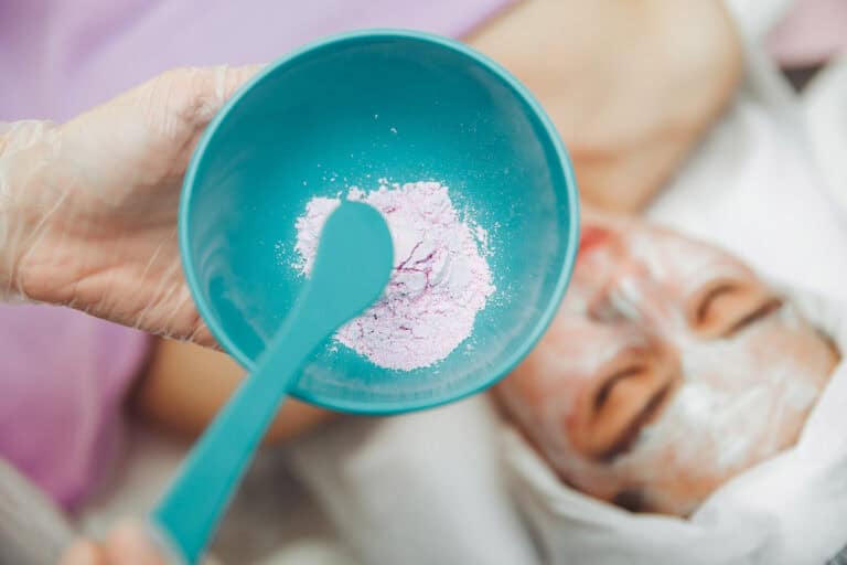 A cosmetologist prepares a lilac alginate mask in Minsk. Alginate mask for the skin. Cosmetology. Skin care procedure